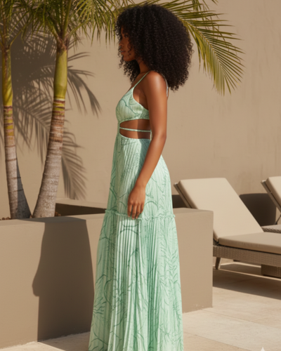 Woman in a mint green resort dress with cutout detail, poolside with palm trees and sun loungers